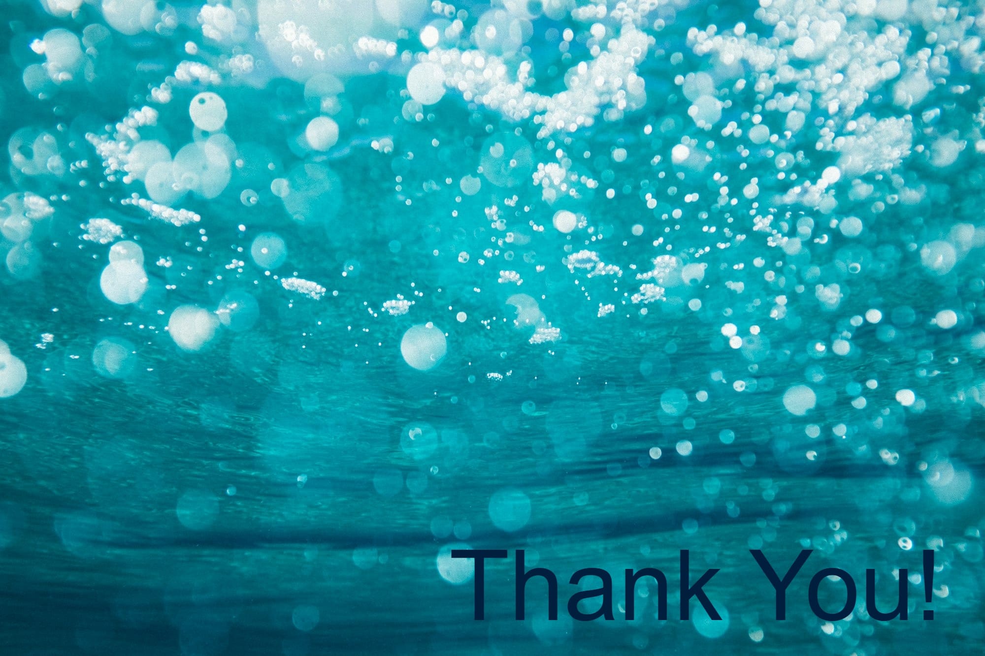 underwater photography of water bubbles